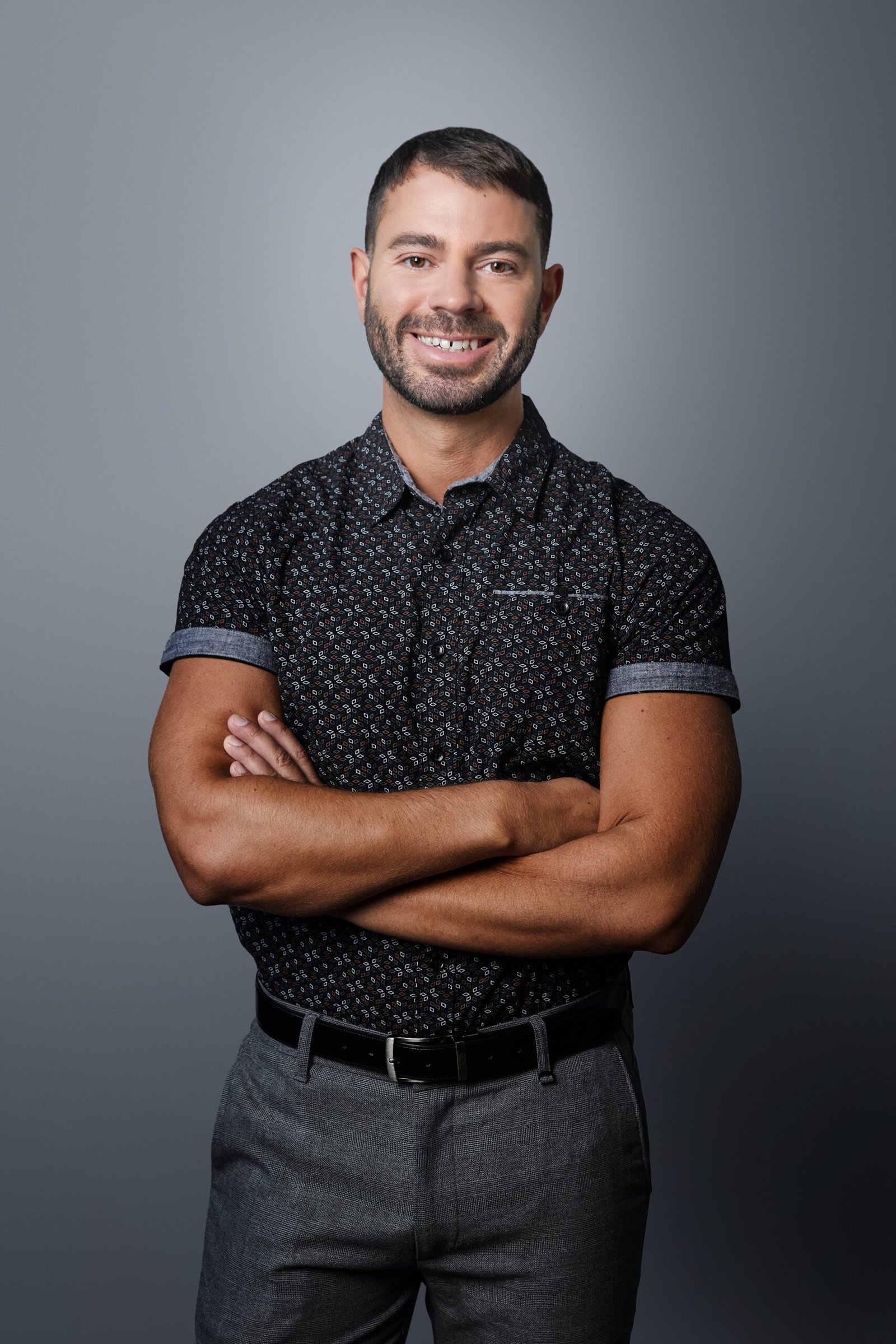 Editorial portrait of Michael DiIorio in a thoughtful pose, soft window lighting.